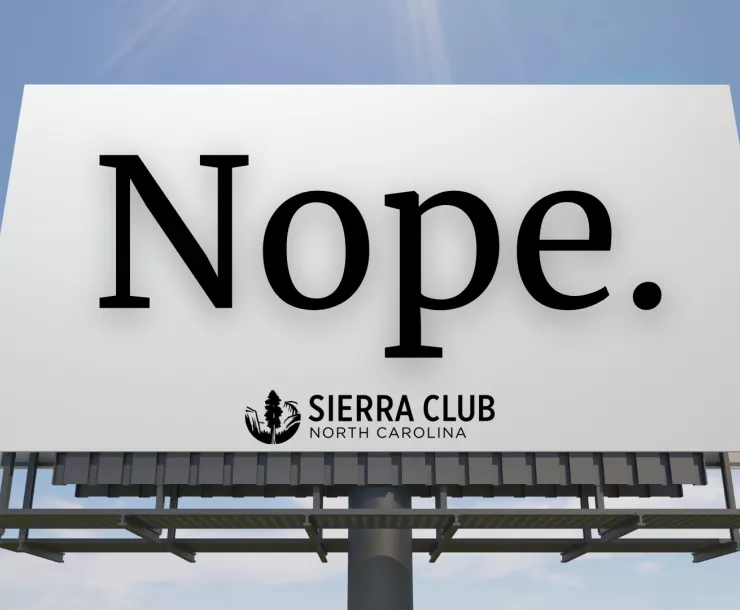 A photo illustration shows a billboard with the word "NOPE" and the NC Sierra Club logo