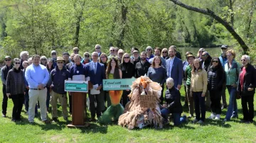 WNC Group volunteers pose with representatives of local governments and environmental allies at a news conference on Earth Day 2024