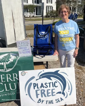 Croatan Group volunteer Harriet Altman at the Group's Earth Day 2024 "Plastic-Free By the Sea" table at the Beaufort Farmers Market