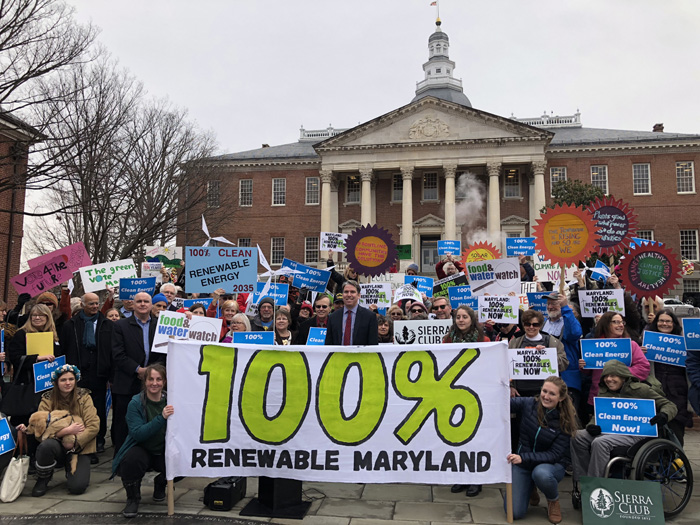 Shane Robinson, center in red tie, at the 100% renewables rally in Annapolis