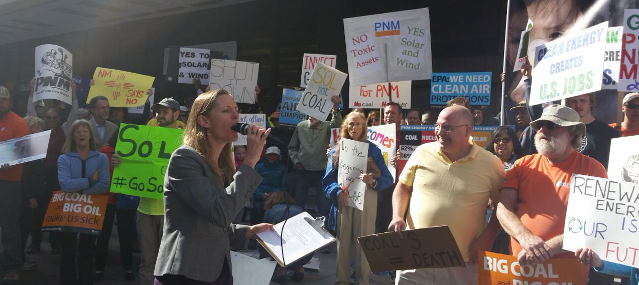 Camilla Feibelman, director of the Rio Grande (New Mexico) Chapter of the Sierra Club, addresses the rally outside PNM's headquarters in Albuquerque