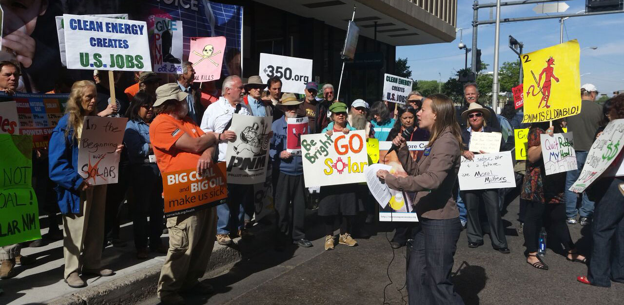 SAnders Moore, director of Environment New Mexico, speaks at rally outside PNM's headquarters in Albuquerque