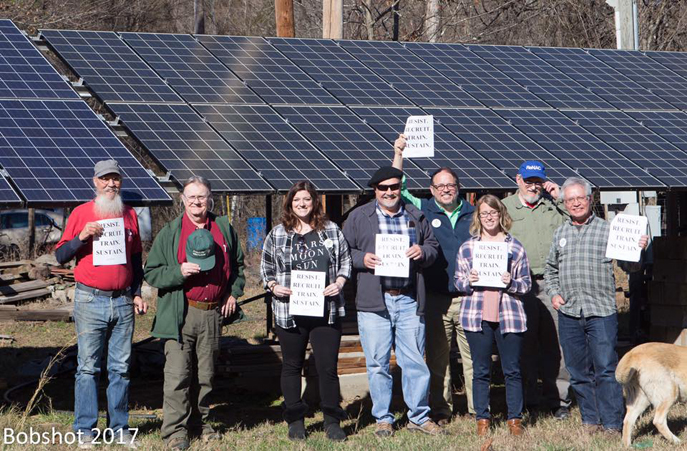 Sierra Club Arkansas Chapter executive committee with solar panels