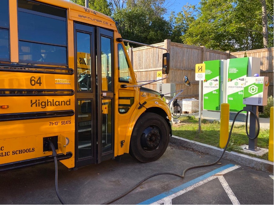Electric school bus, plugged in to charge. Photo credit: Proterra