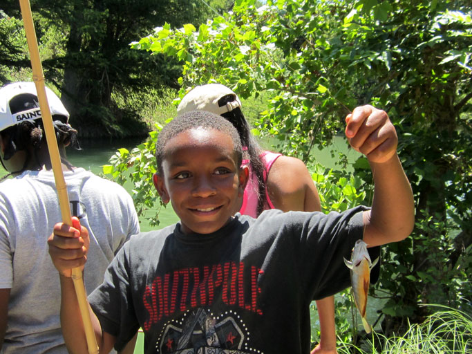 Young student with the fish he caught