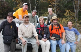 A group of faithful trail builders waiting to be transported to the work site.