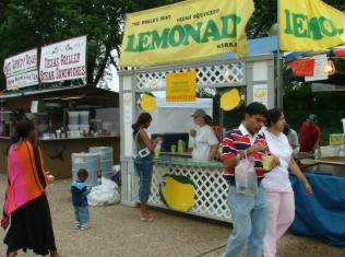 Fairgoers enjoying our fresh-squeezed lemonade at our south leg booth.