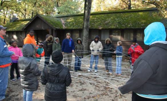 Young naturalists participate in an exercise to illustrate relationships in nature.