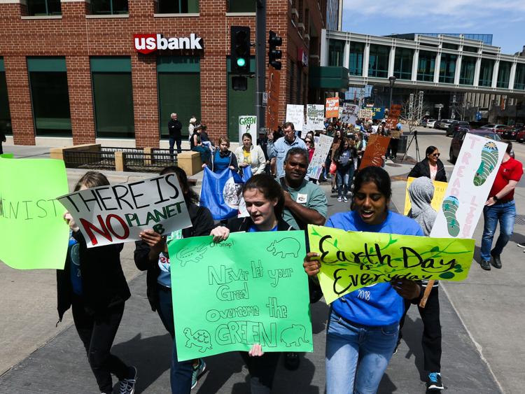 Rochester high school students leading the Earth Day People's Climate March in downtown Rochester, MN