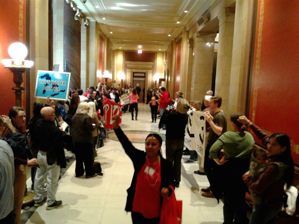 People rallied outside the Minnesota House Chamber with signs, drums, chanting and prayers, opposing the Enbridge Line 3 Pipeline and the Energy bill that supports it. They left a path for House members to get to the chamber.