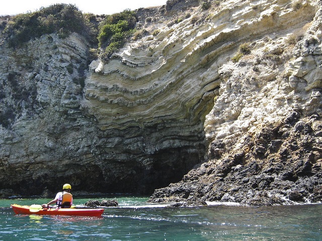 Kayaker in a calm cove