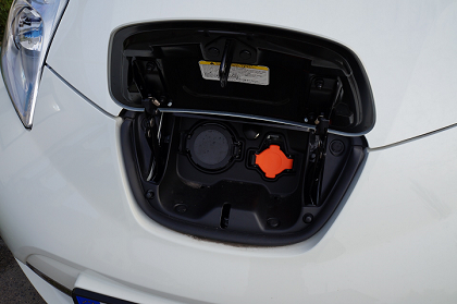 Charging port on the front of a white electric vehicle