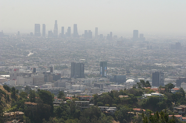 Long, aerial view of the skyline of downtown LA on a very smoggy day