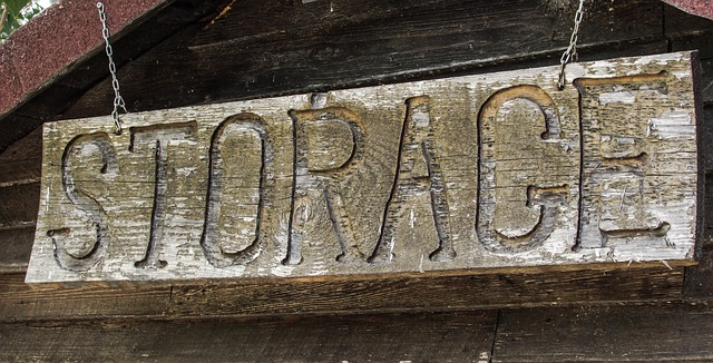 Weathered wooden sign with the word Storage carved into it
