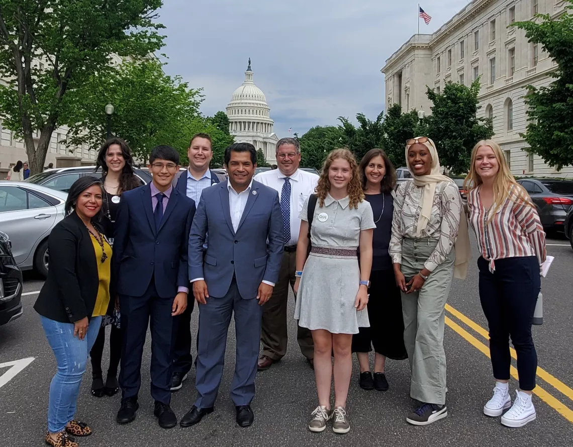 Rep. Jimmy Gomez stands for a photo with youth environmental leaders and members of the Outdoors Alliance for Kids on May 18, 2022.
