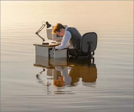 Man at desk in water