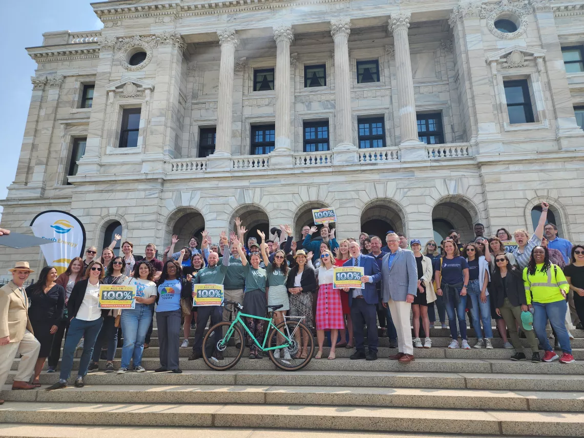Activists celebrate legislative success on the steps of the Minnesota State Capitol
