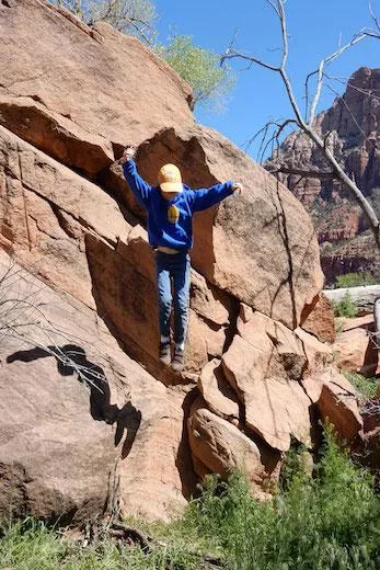 Coleman bonds with the boulders at Zion National Park.