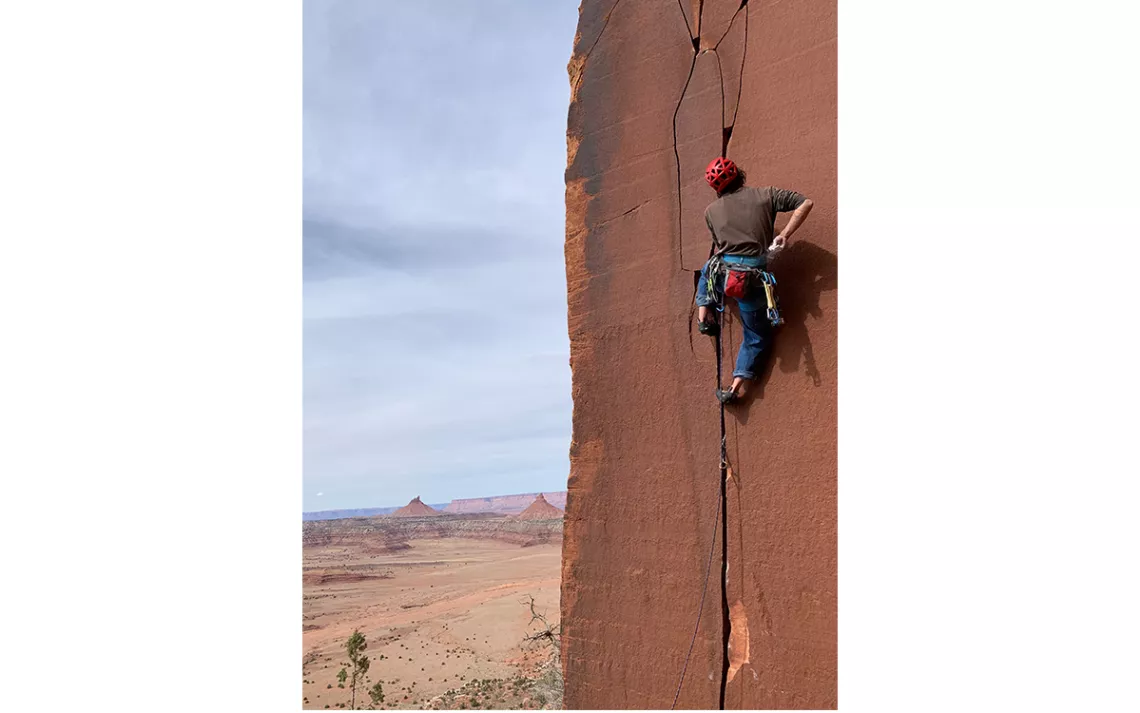 Dave Marcinowski on a route called Microdose in Indian Creek, Bears Ears National Monument