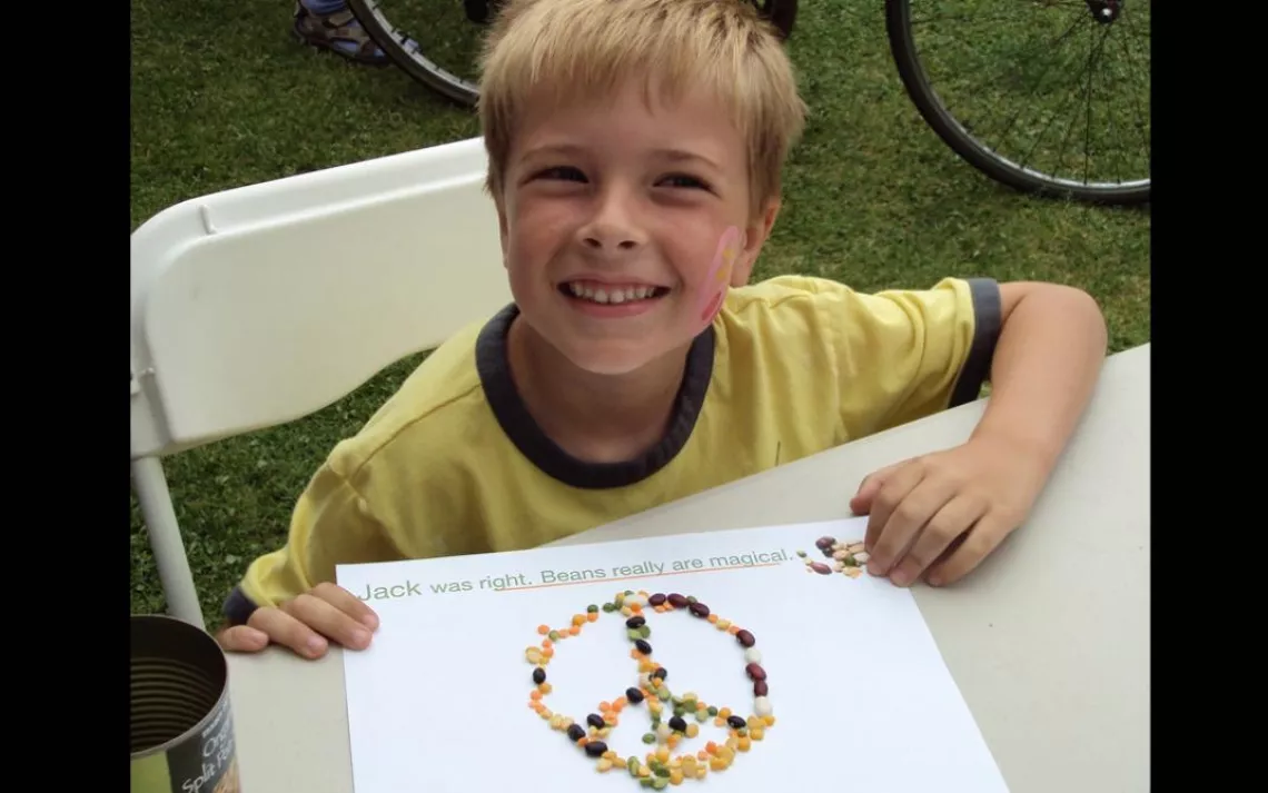 A young boy gets creative with beans.