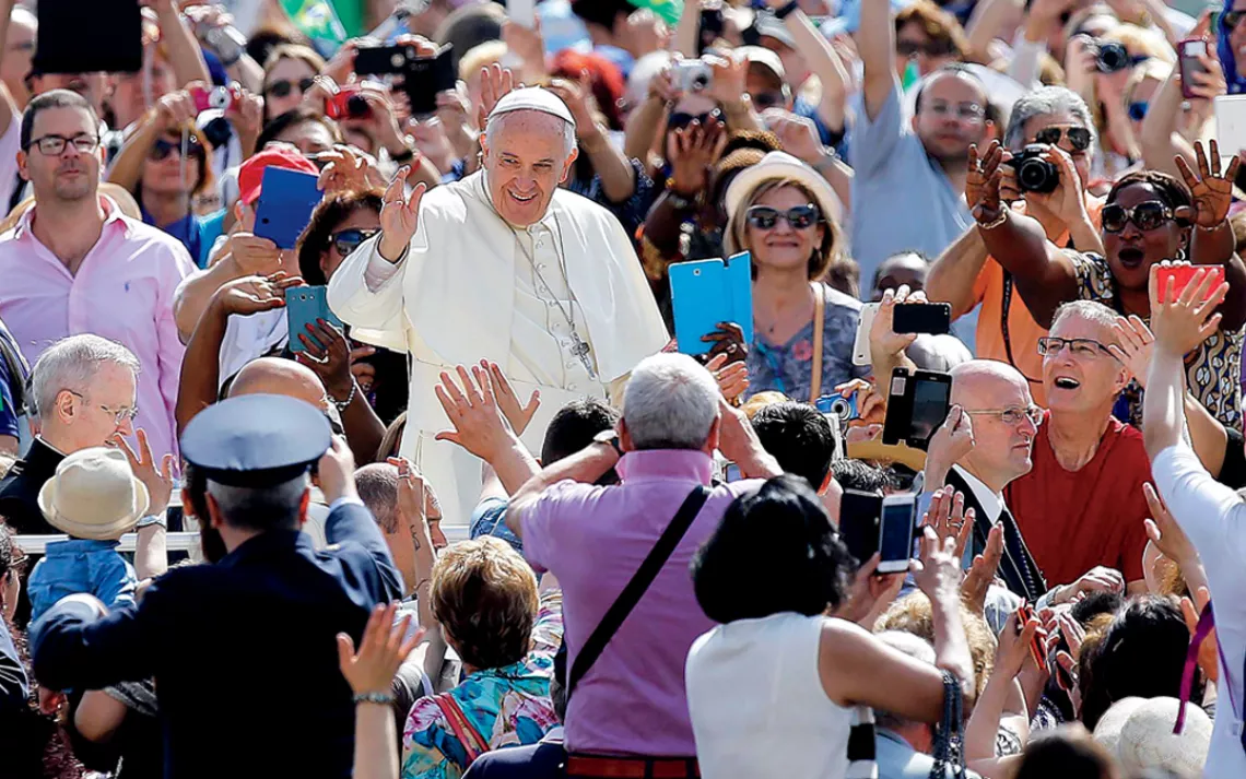 Pope Francis greets the crowd as he arrives in St. Peter's Square, Vatican City.