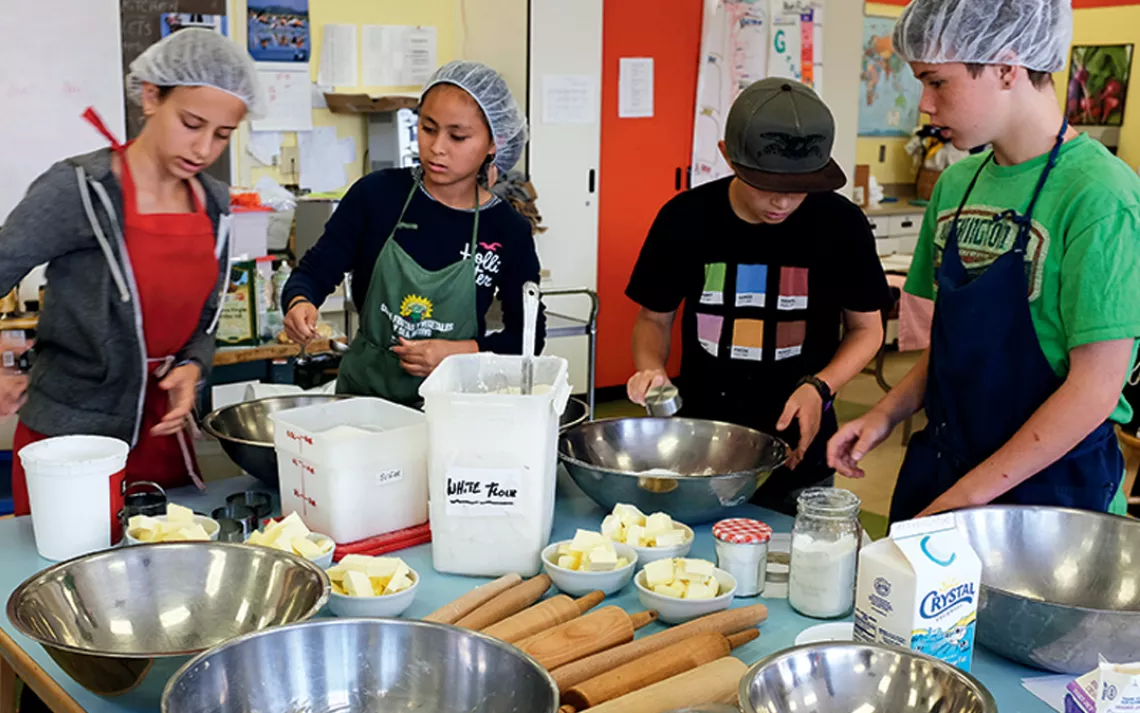 Self-financing cooking program: The seventh and eighth graders in Growing Leaders plan, cook, and sell 220 meals a week.