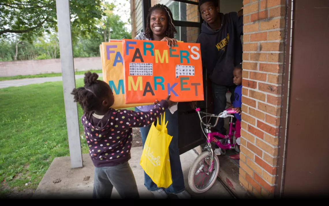 Alisha Winters, 31, takes son Robert Connor, 13, and daughters Myshelle James (with bike), 4, and Deborah Smith, 5, to volunteer at a local farmers' market. "I'm very hopeful," Winters said. "In 10 years I picture Rouge being a very clean, safe environmen