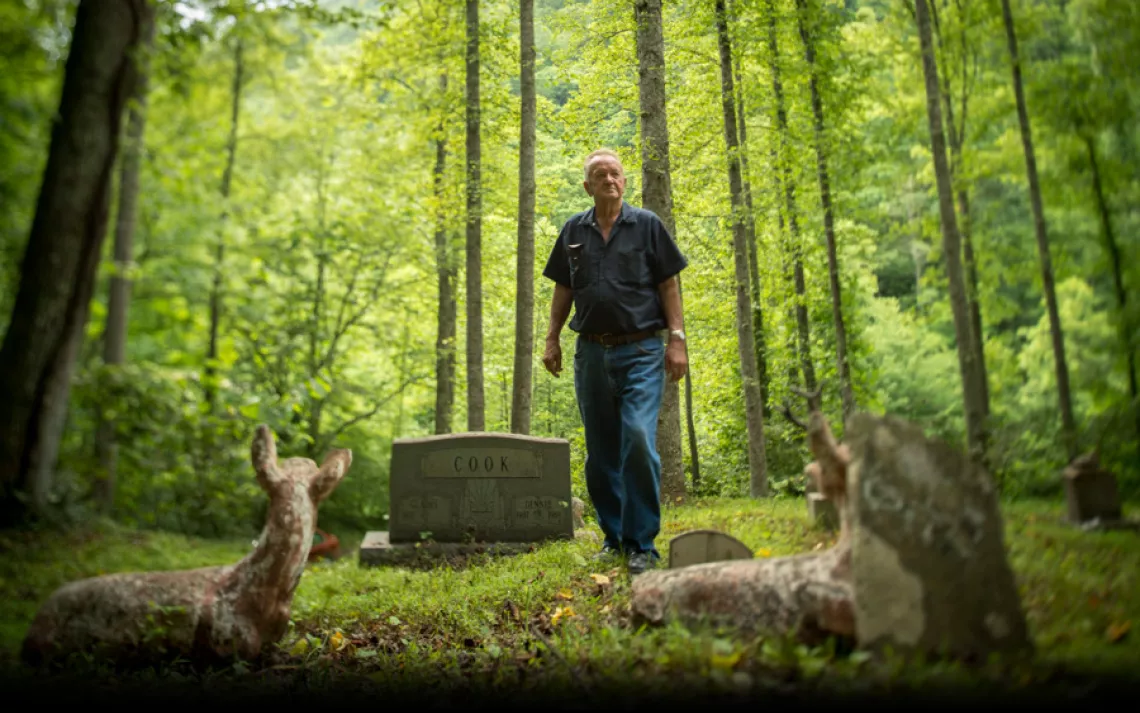 Not far from his Bandytown home, Leo Cook visits the Webb Cemetery, where several of his relatives are buried. | Ami Vitale/Panos Pictures