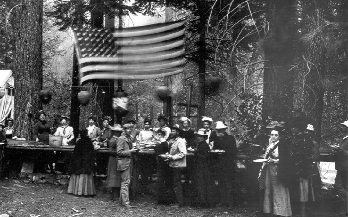 Serving dinner, 4th of July 1902 at Kings River. By Joseph N. LeConte.