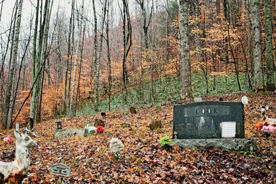 Dustin White's family graveyard lies in a hollow between two mountains that mining companies are flattening to get at their coal.