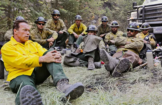 Arnold Schwarzenegger hangs out with firefighting "hotshots" in Years of Living Dangerously, a new series by David Gelber (top left) and Joel Bach (below).