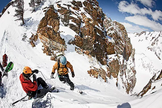 At Sawtooth Mountain Guide's backcountry camp, participants practice hurtling down a steep slope.