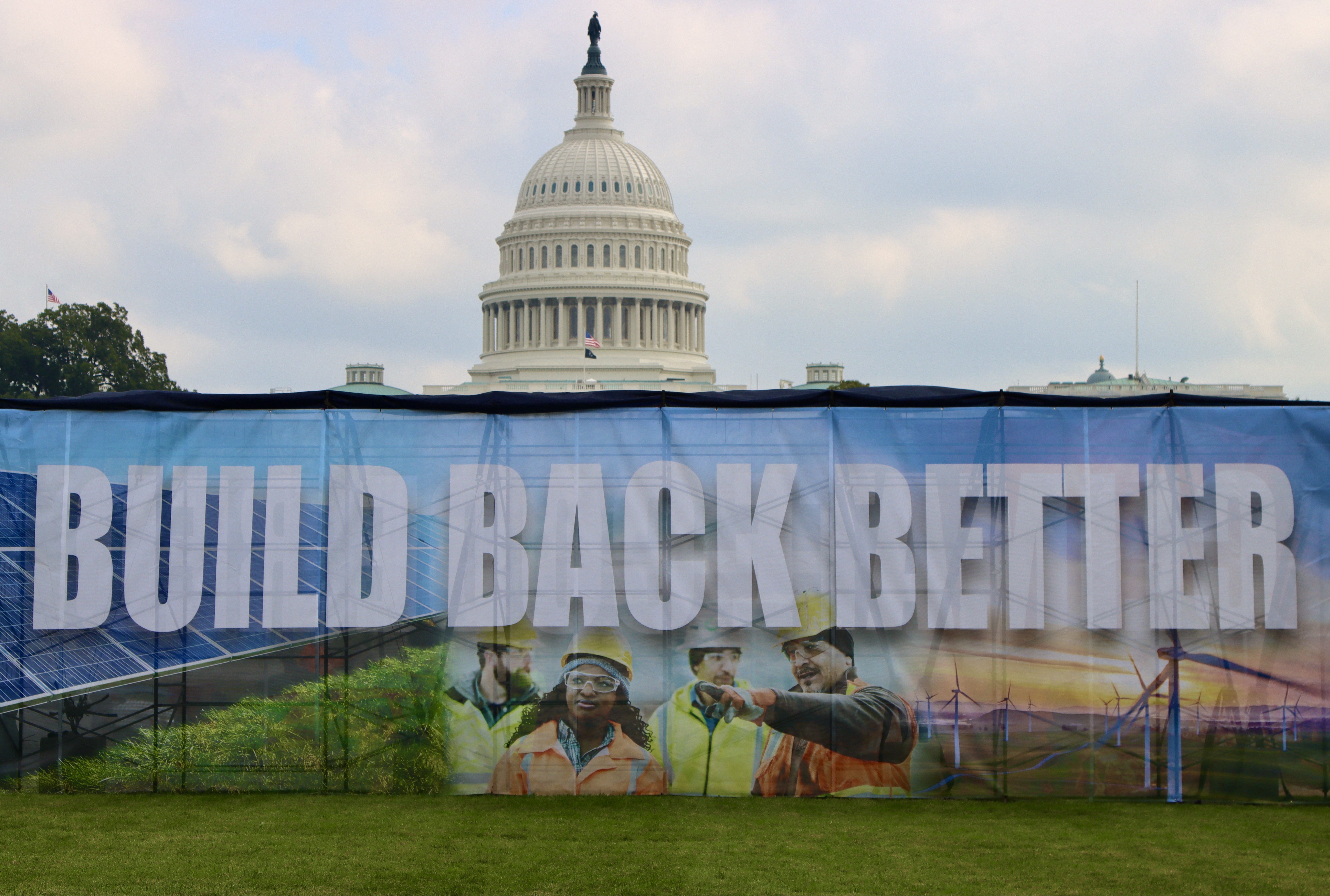 A Build Back Better sign in front of Congress