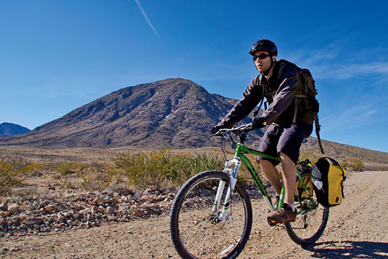 The author biking on Wind Mountain, a potential source of rare earth elements. | Peter Frick-Wright