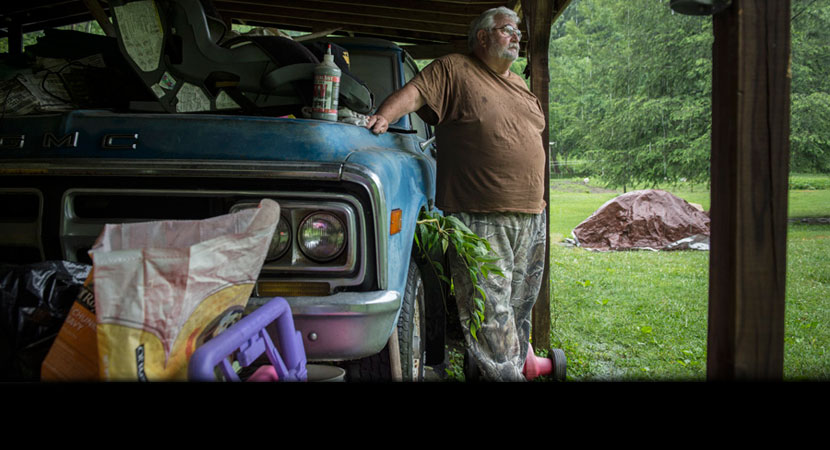 Bella parked his Ford beside his house the day he got laid off from his last coal mining job in 1999 and hasn't driven it since. "All my work clothes and stuff still's in it," he said. "Ol' greasy coverall and all." | Ami Vitale/Panos Pictures