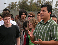 Christian Ramirez gathers with family through the San Diego/Tijuana border wall.