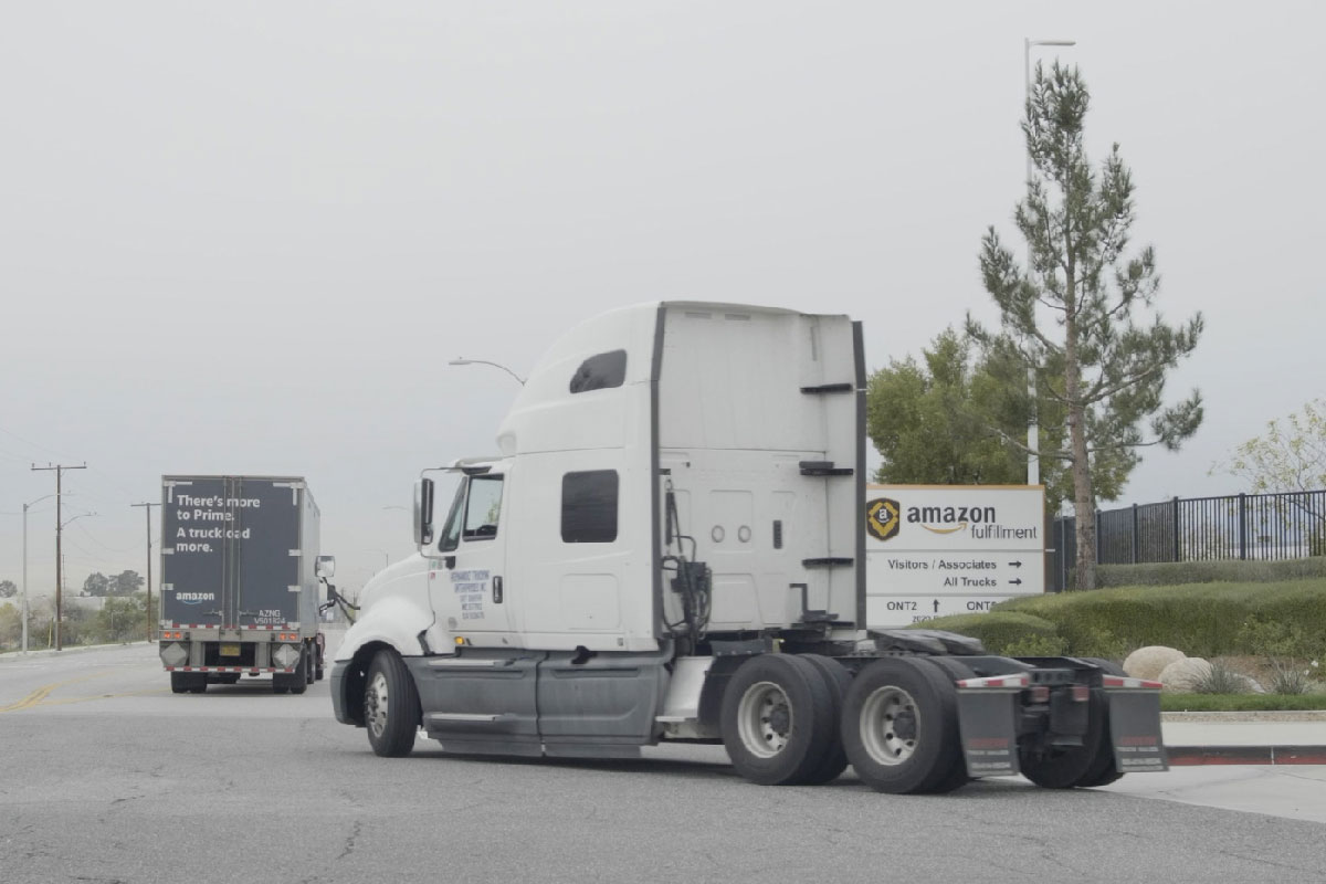 Truck tractors leaving empty from Amazon distribution center.