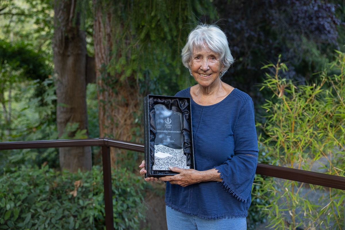 Marjie Fields holding her award