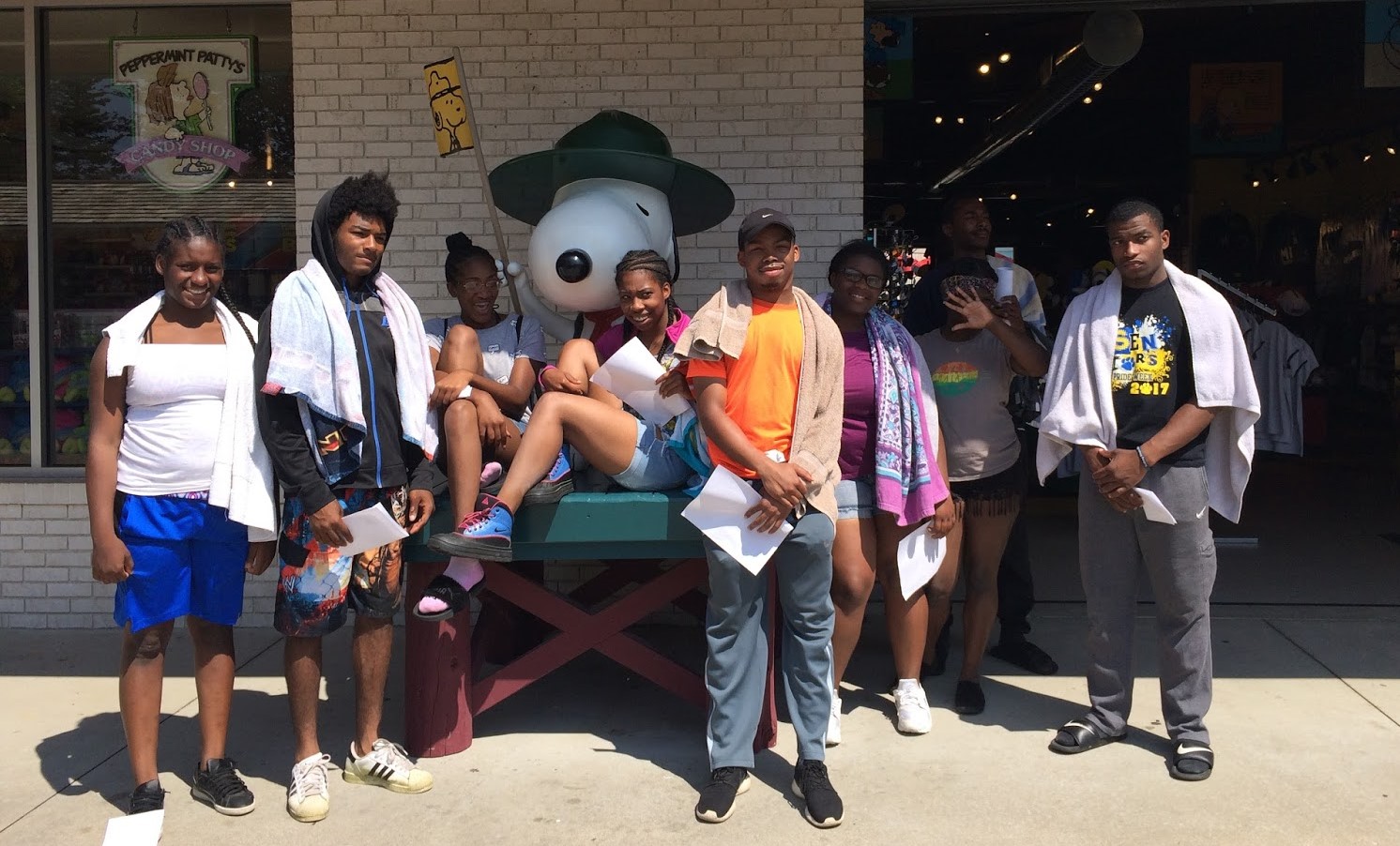 Detroit ICO participants pose in front of a Snoopy statue at Michigan's Adventure.