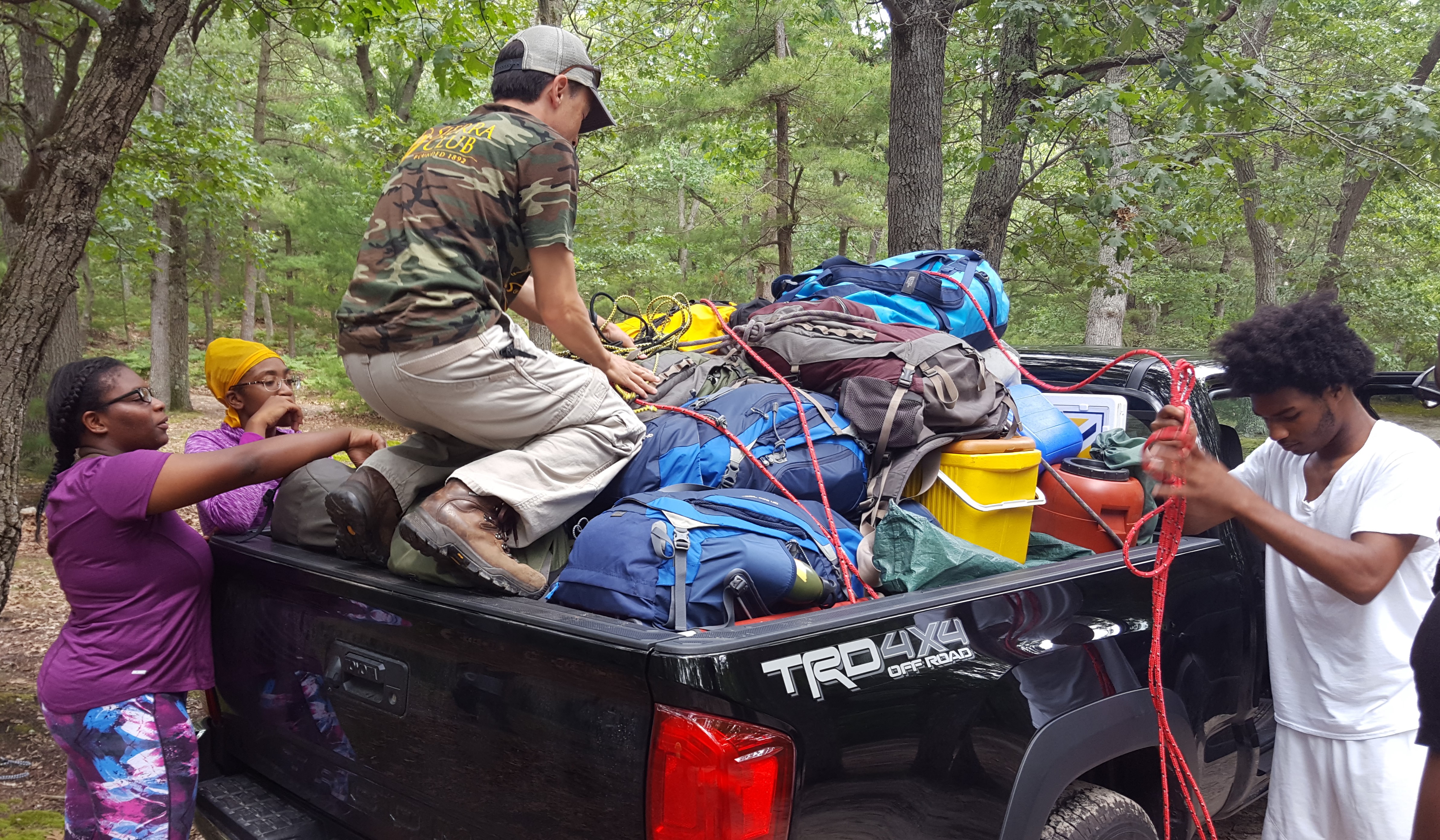Detroit ICO participants unpack all of their equipment at the campsite.
