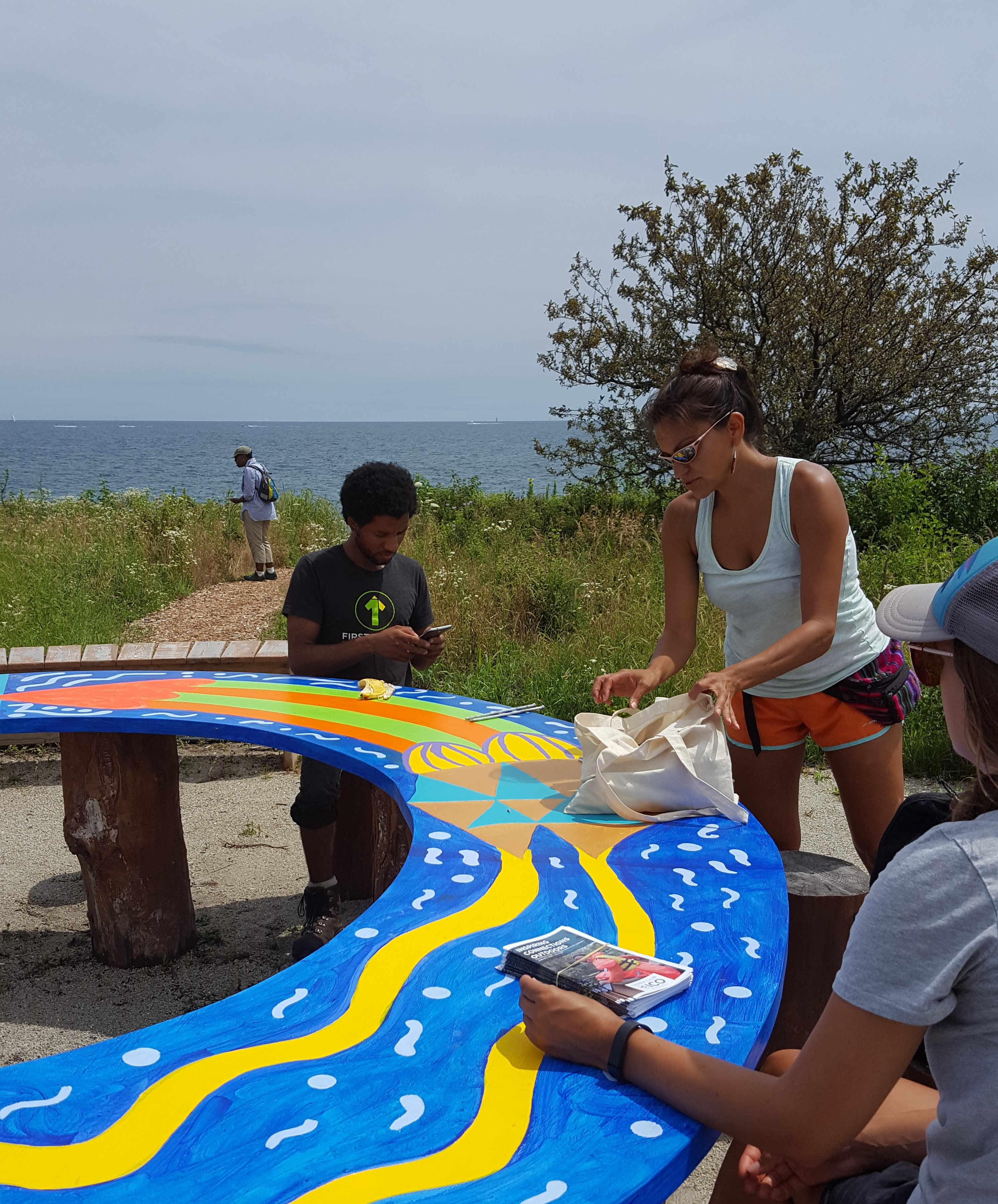Katty Regalado sets up before a Chicago ICO participant meeting along the lake.