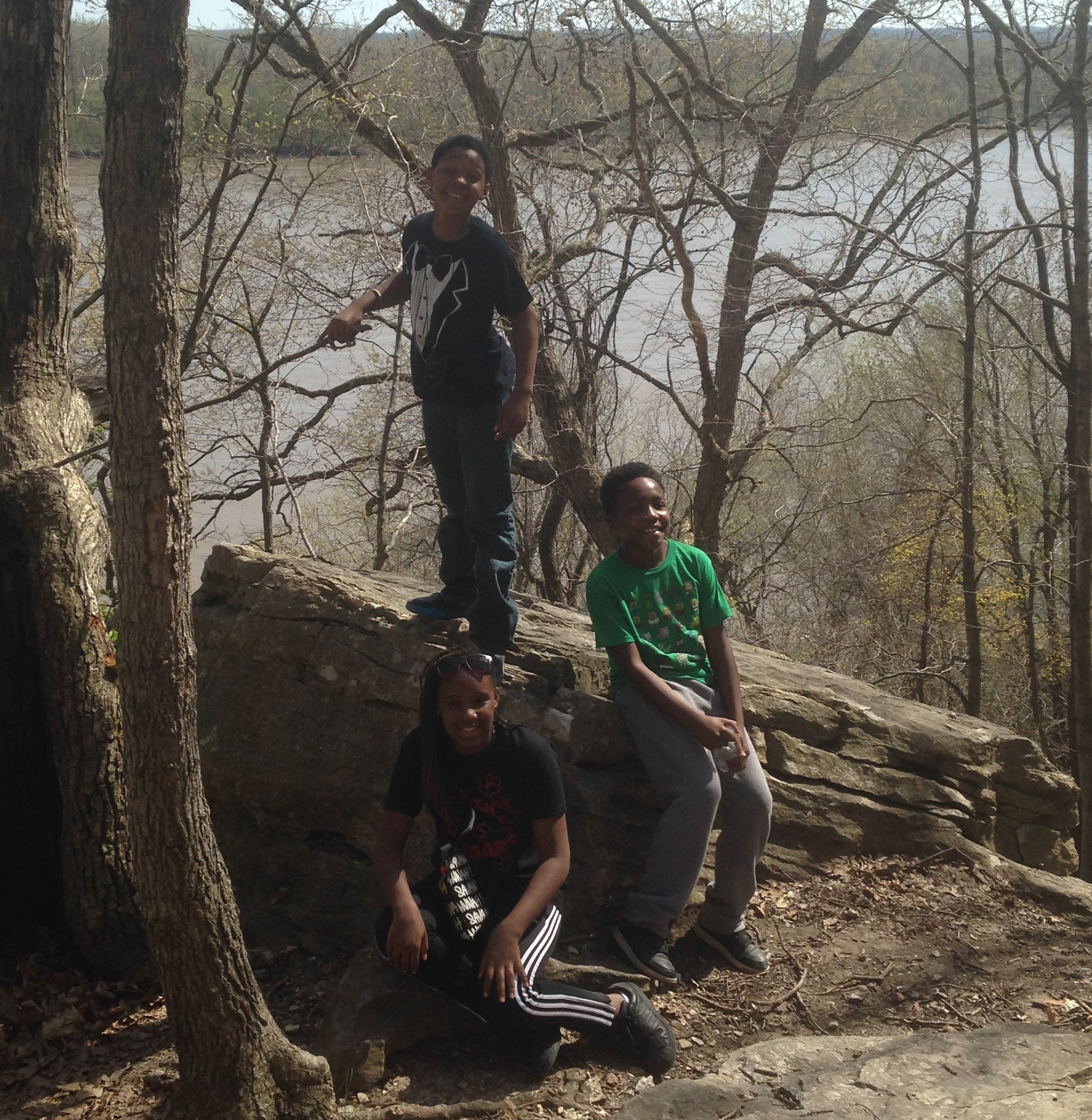 St. Louis ICO participants stop along a trail to smile at the camera.