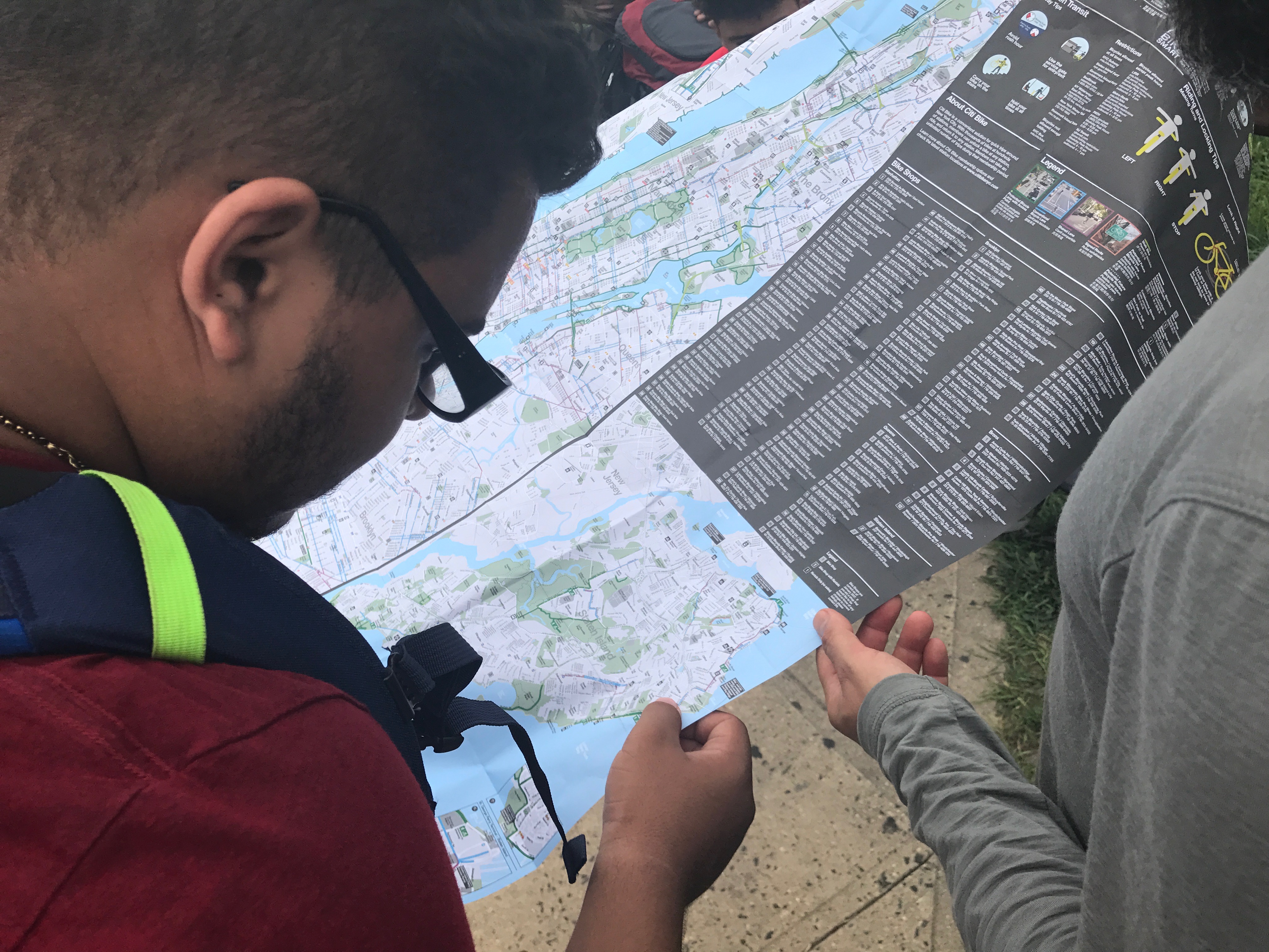 NYC ICO participant studies a map on their urban backpacking trip.