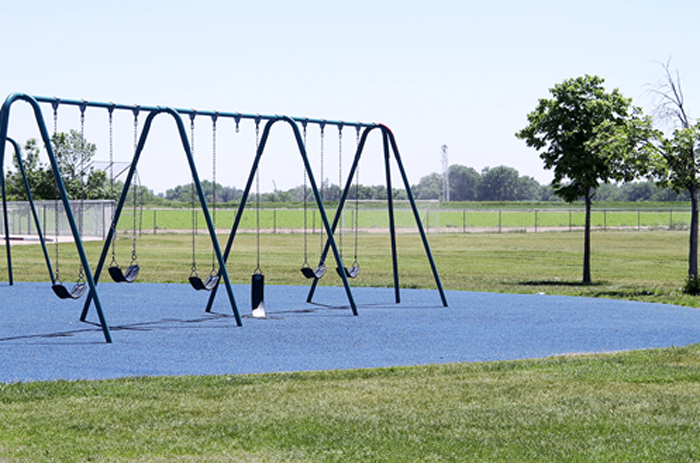 Playground at Bella Romero Academy in Greeley, Colorado, with the proposed oil and gas development site just beyond the fence