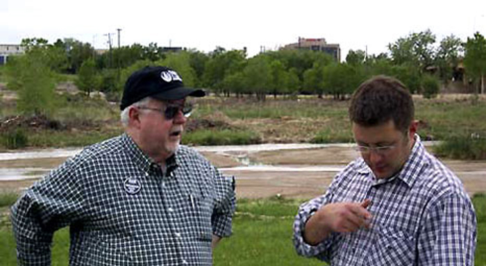 Ross Vincent talks with Sal Pace, district manager for former U.S. Congressman John Salazar of Colorado
