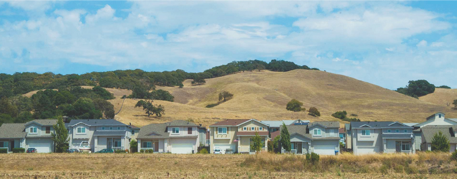 houses at the edge of farmland