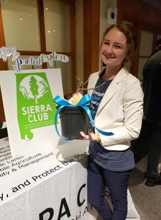 (at left: Marley hopes to locate her green thumb with a fig tree she won at the February 8th Faith Meets Business: Climate Solutions for the Common Good summit.)