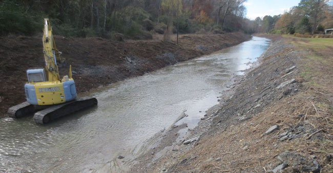Backhoe in the Stream