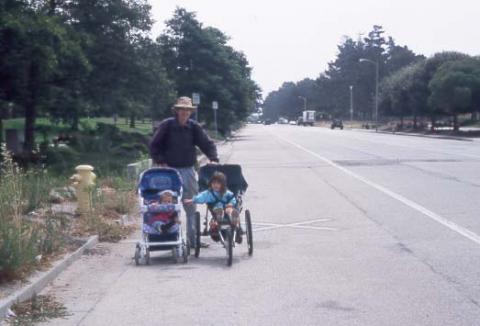 Grandfather pushing strollers