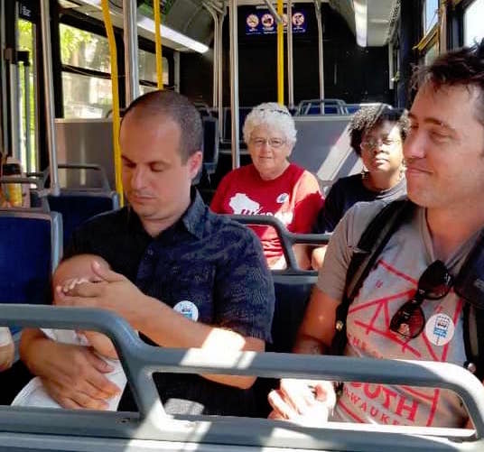 Riders on a bus for the Transit Day of Action
